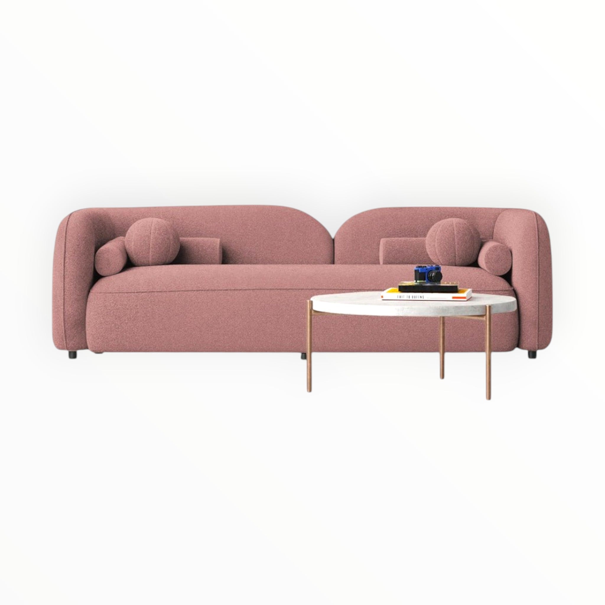 Pink sofa with a small round table on a white background