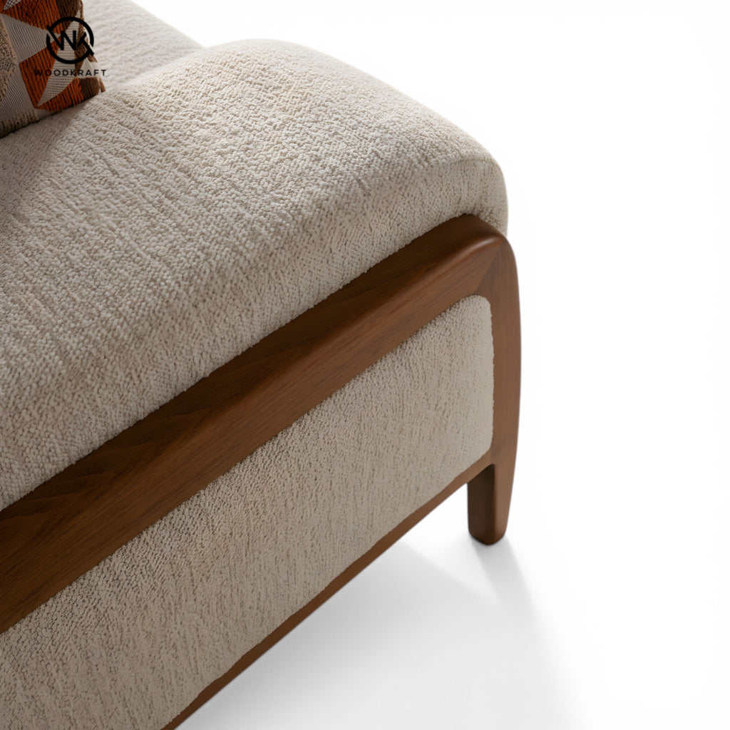 Beige upholstered chair with wooden armrests on a white background