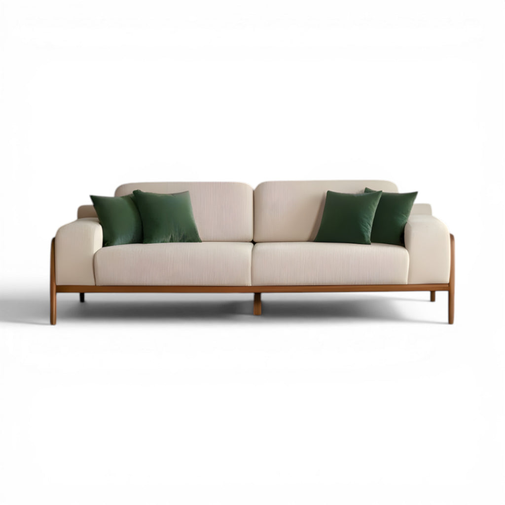 Beige sofa with green cushions on a white background