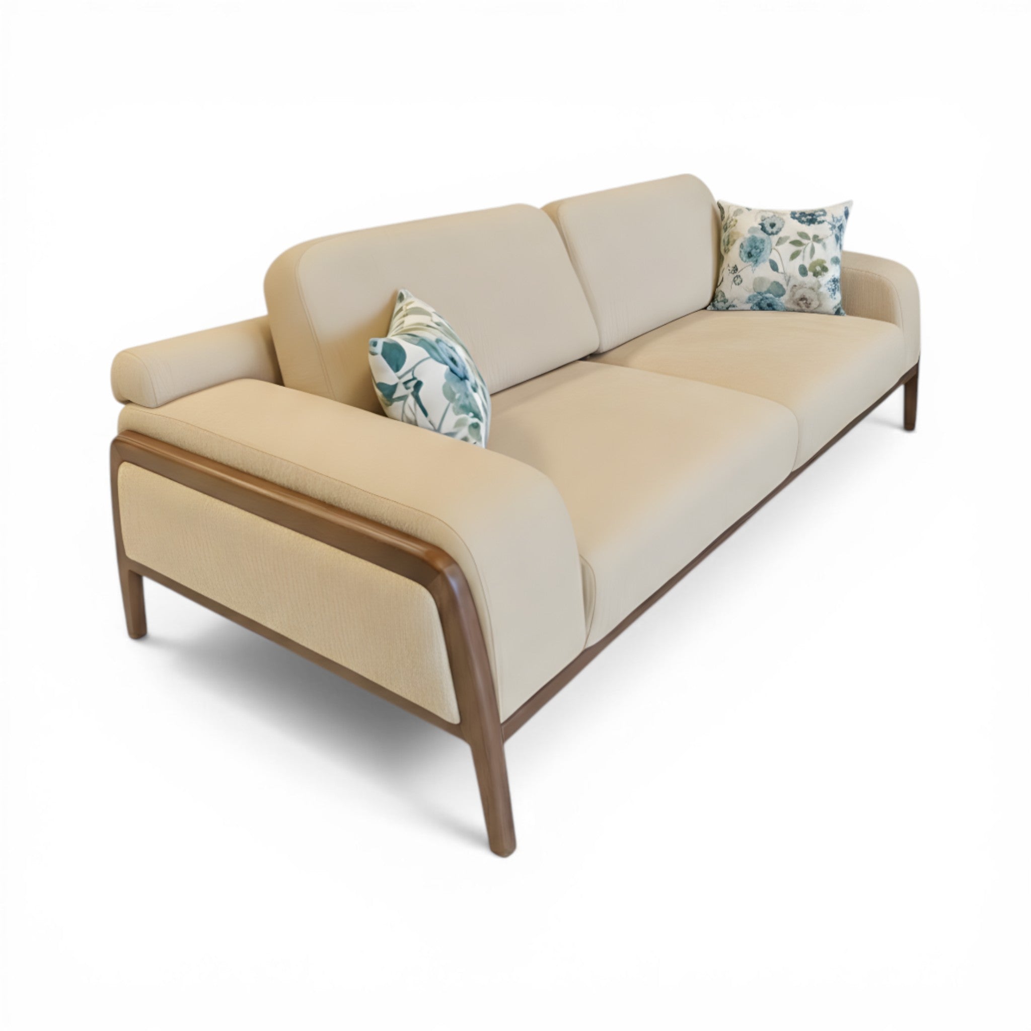Beige sofa with wooden armrests and floral cushions on a white background