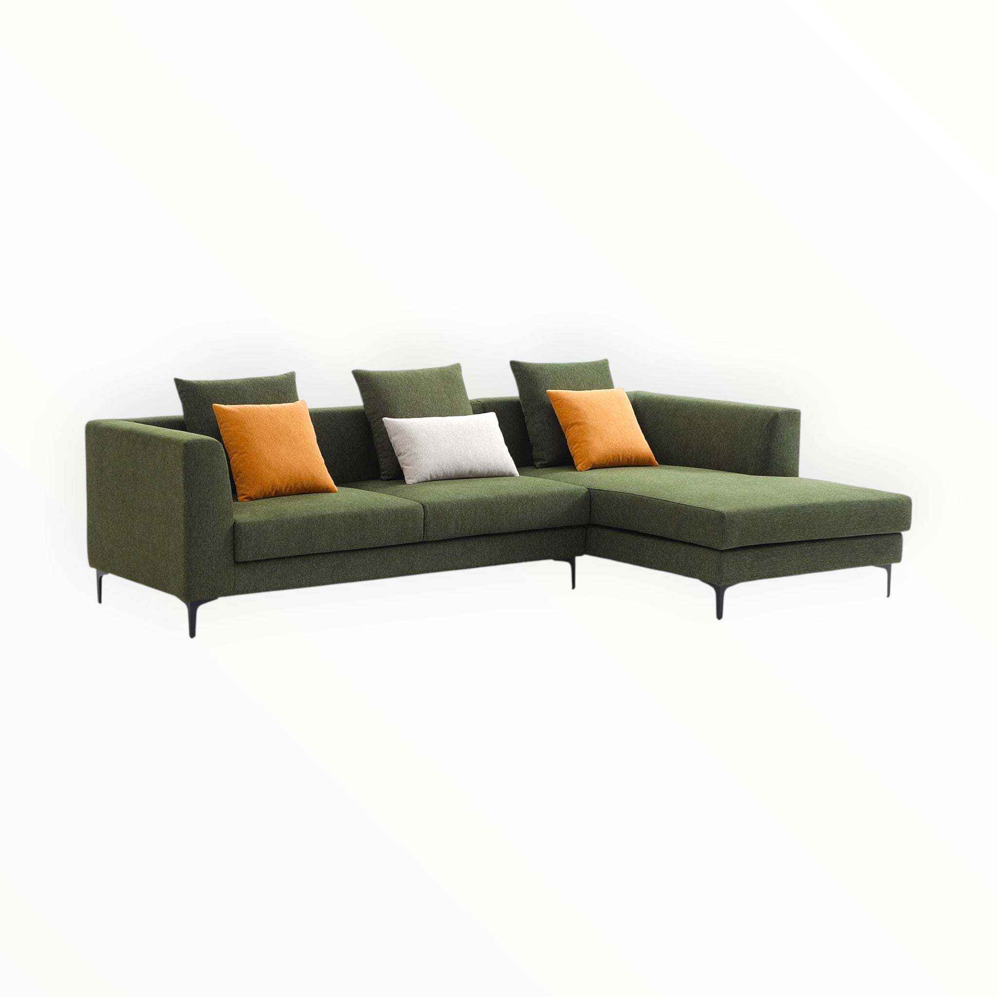 Green sectional sofa with colorful cushions on a white background