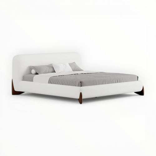 White bed with gray bedding on a white background