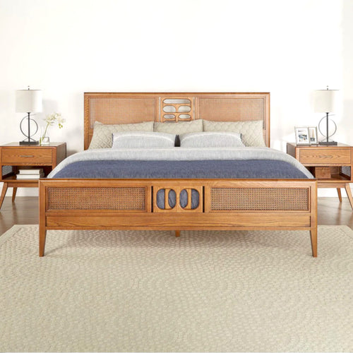 Wooden bed with wicker accents in a bedroom setting