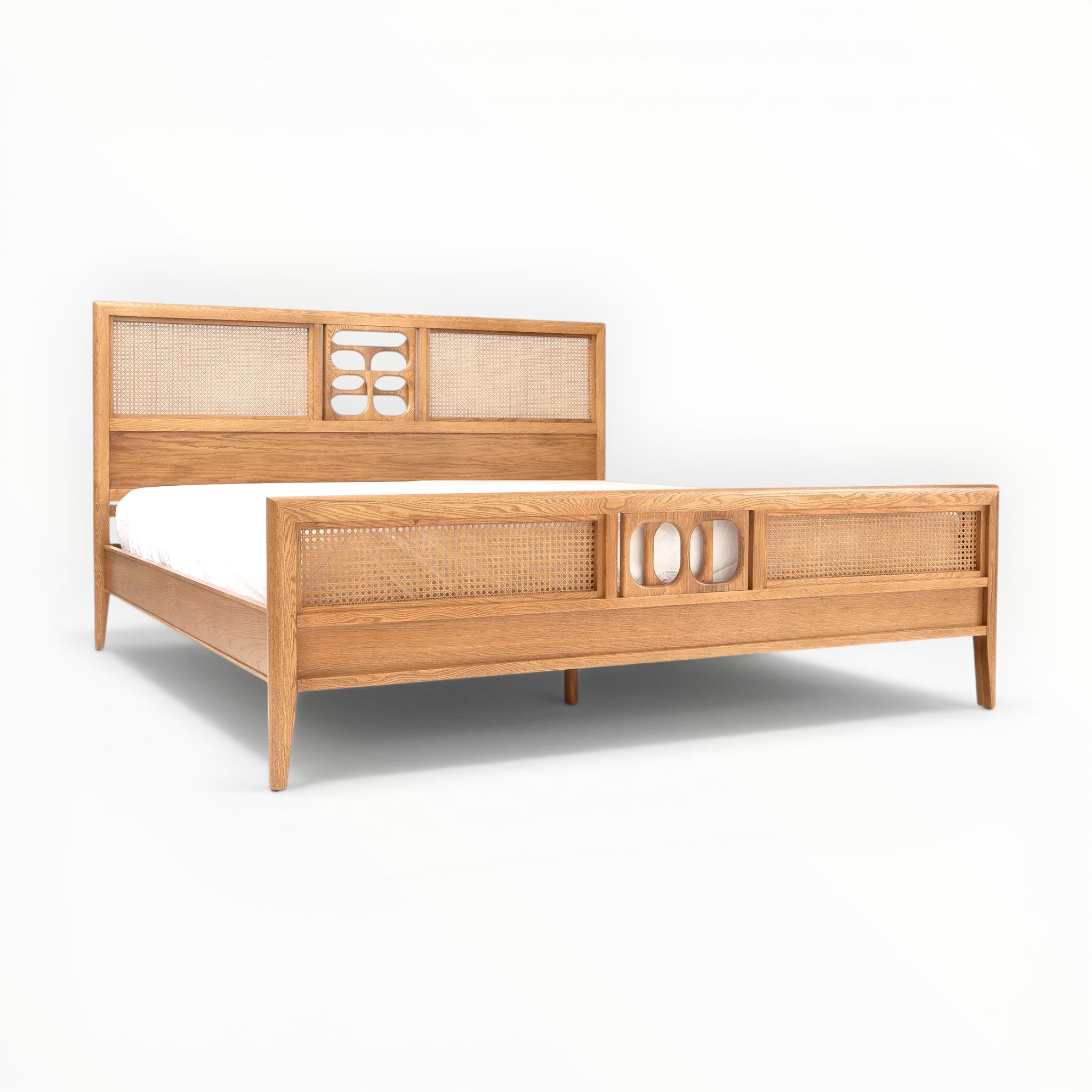 Wooden bed with wicker accents on a white background