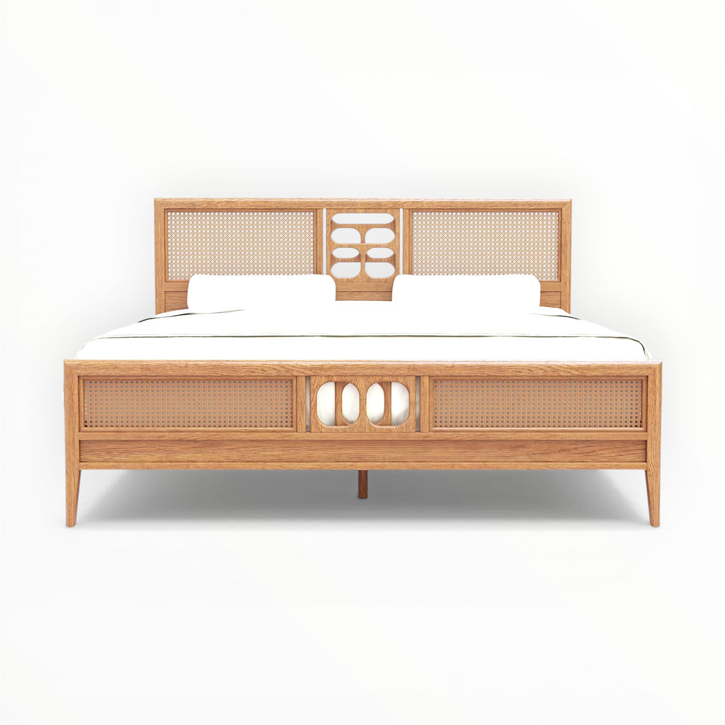 Wooden bed with wicker headboard and footboard on a white background
