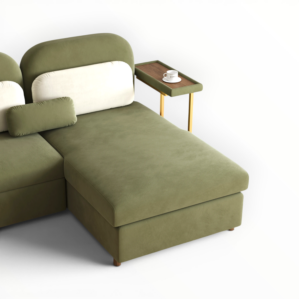 Green sectional sofa with a side table on a white background