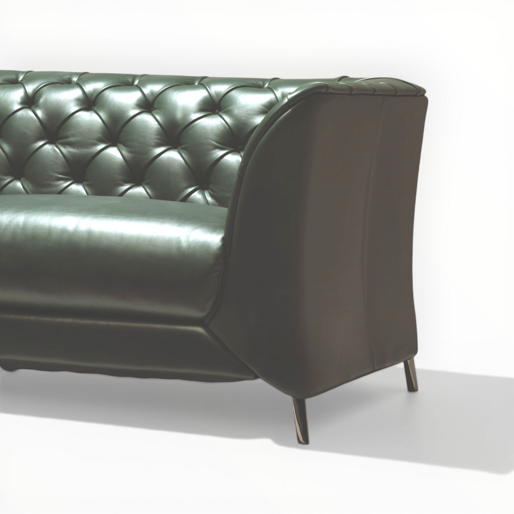Green leather sofa on a white background