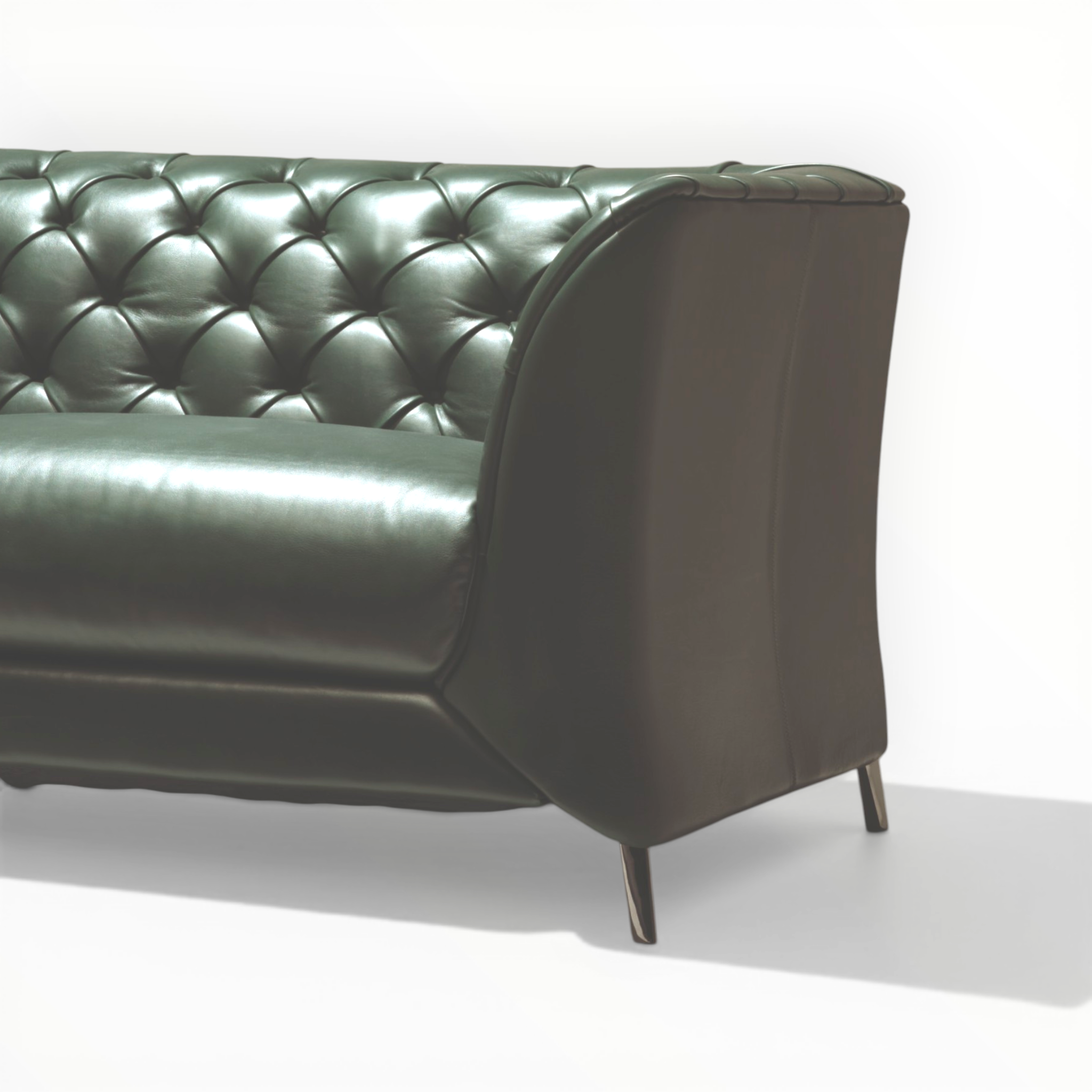Green leather sofa on a white background