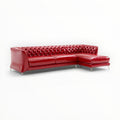 Red leather sectional sofa on a white background
