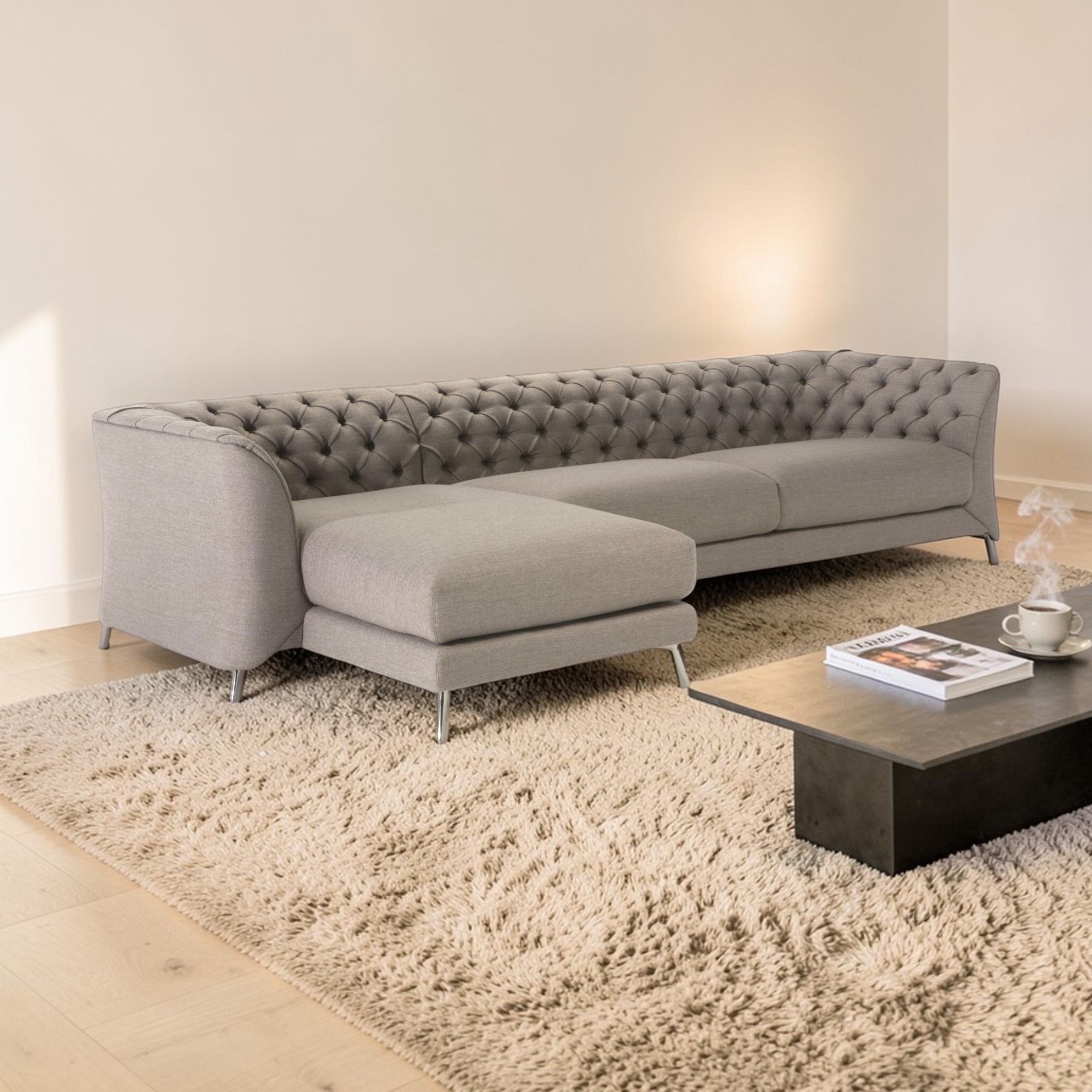 Gray sectional sofa in a living room with a coffee table and rug.