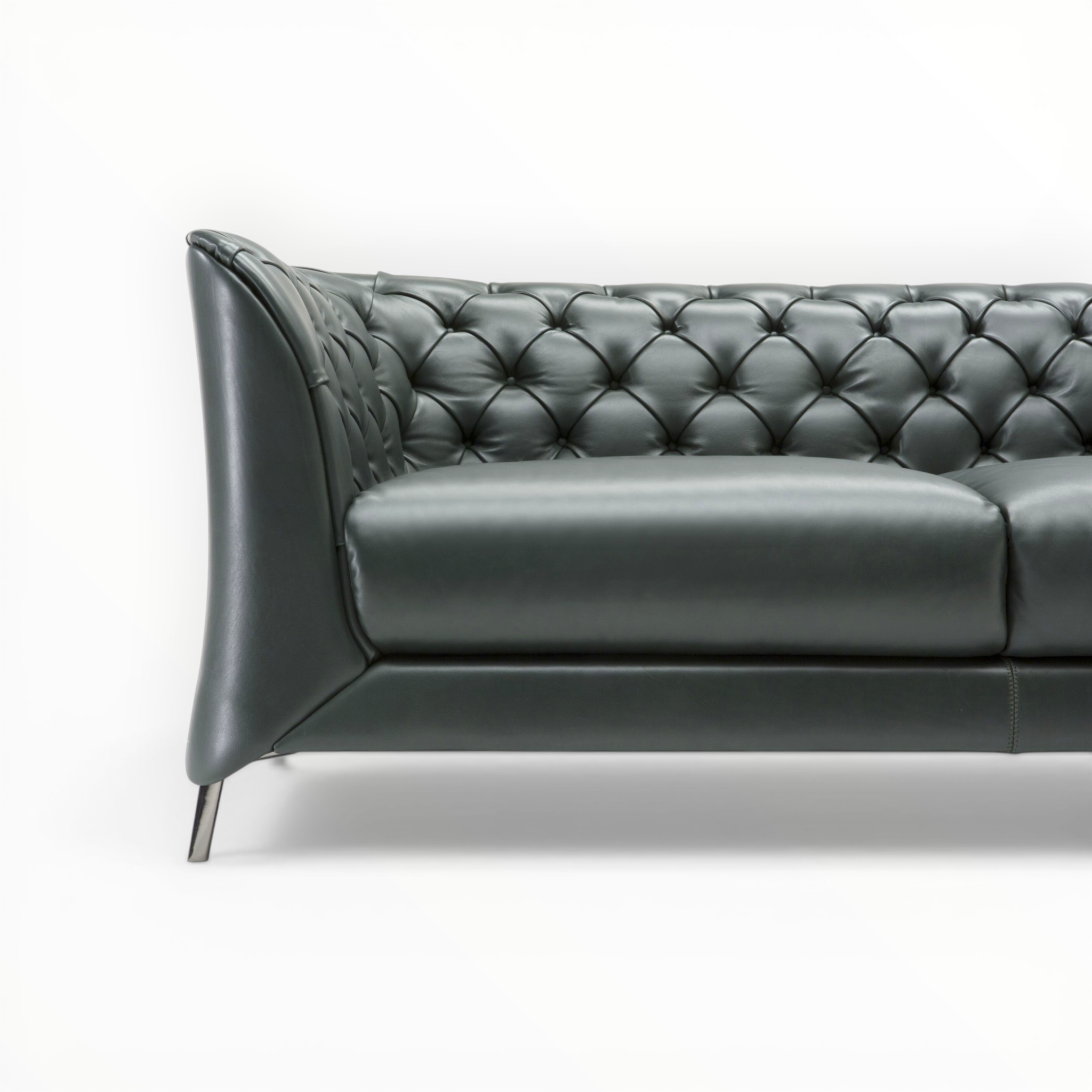 Gray tufted sofa on a white background