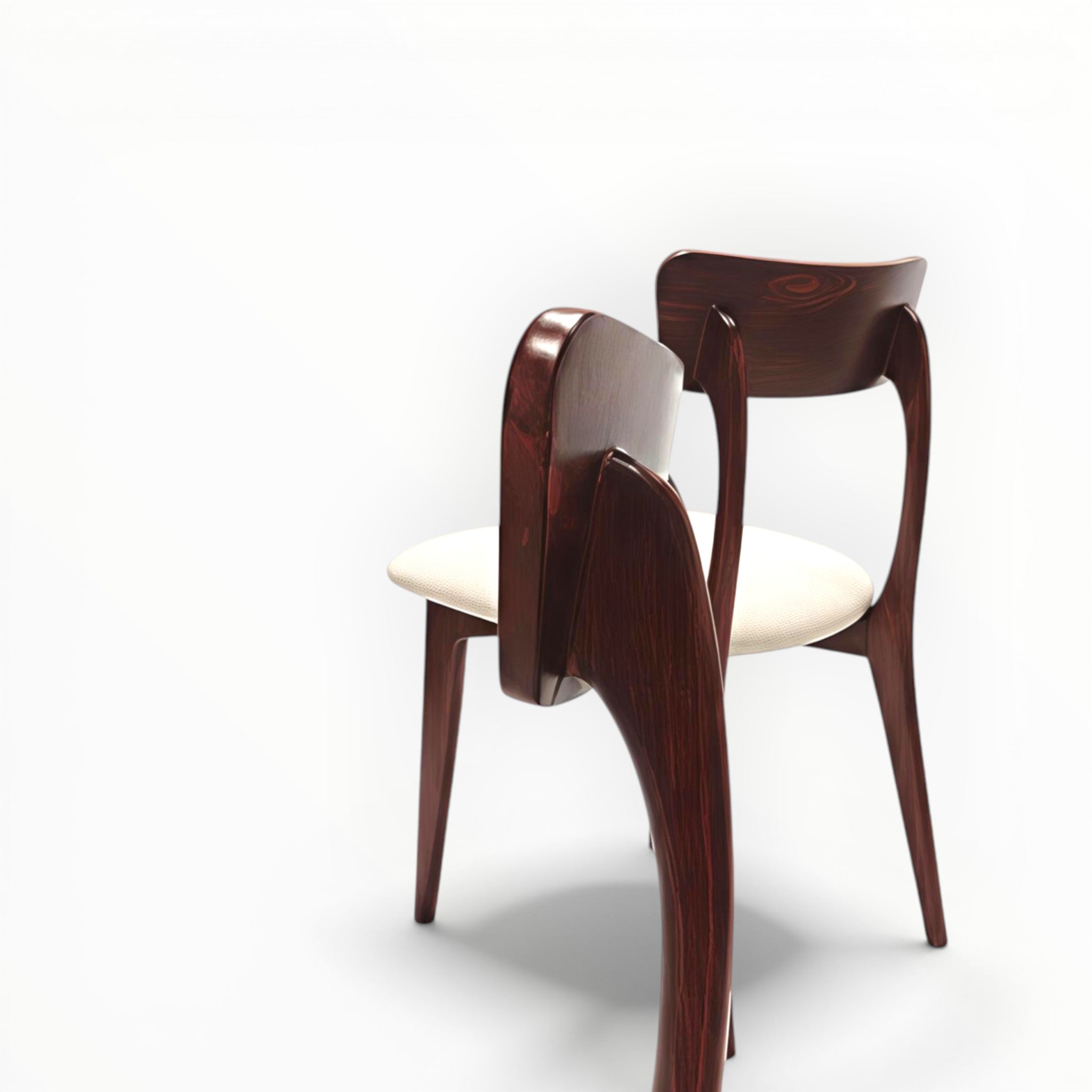 Two wooden chairs with white cushions on a white background