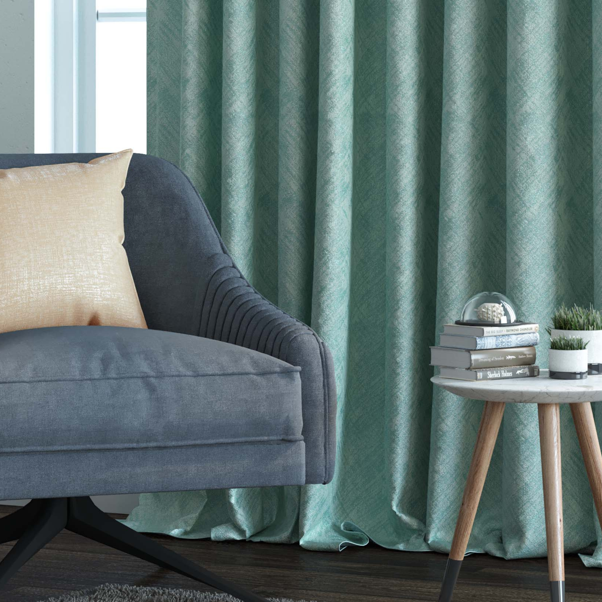 Textured teal-green jacquard curtain with a fine crosshatch weave, hanging in deep folds beside a grey sofa with a gold cushion and a round side table