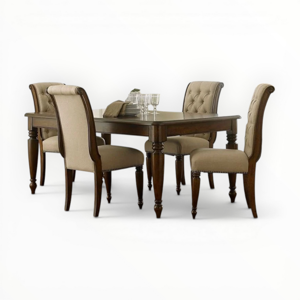 Dining table set with four chairs on a white background