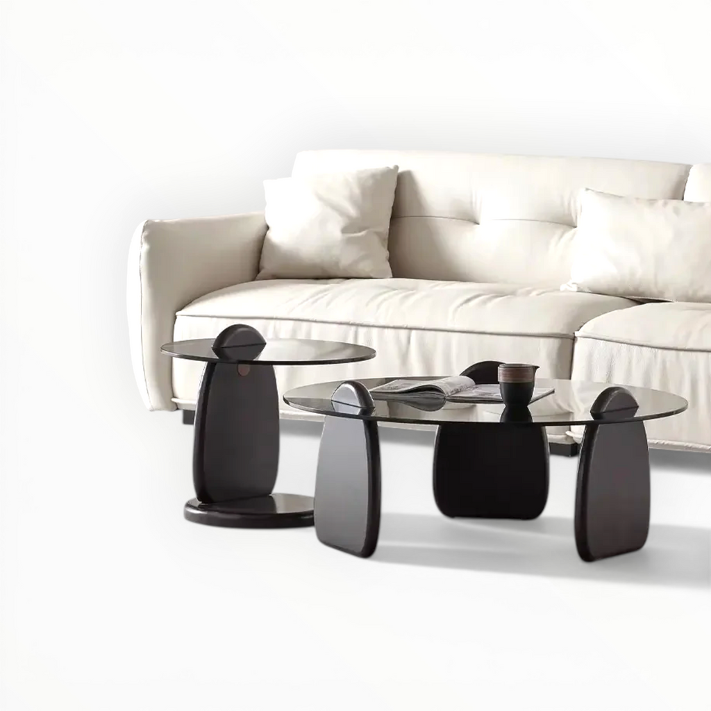 Modern living room with a white sofa and glass coffee table.
