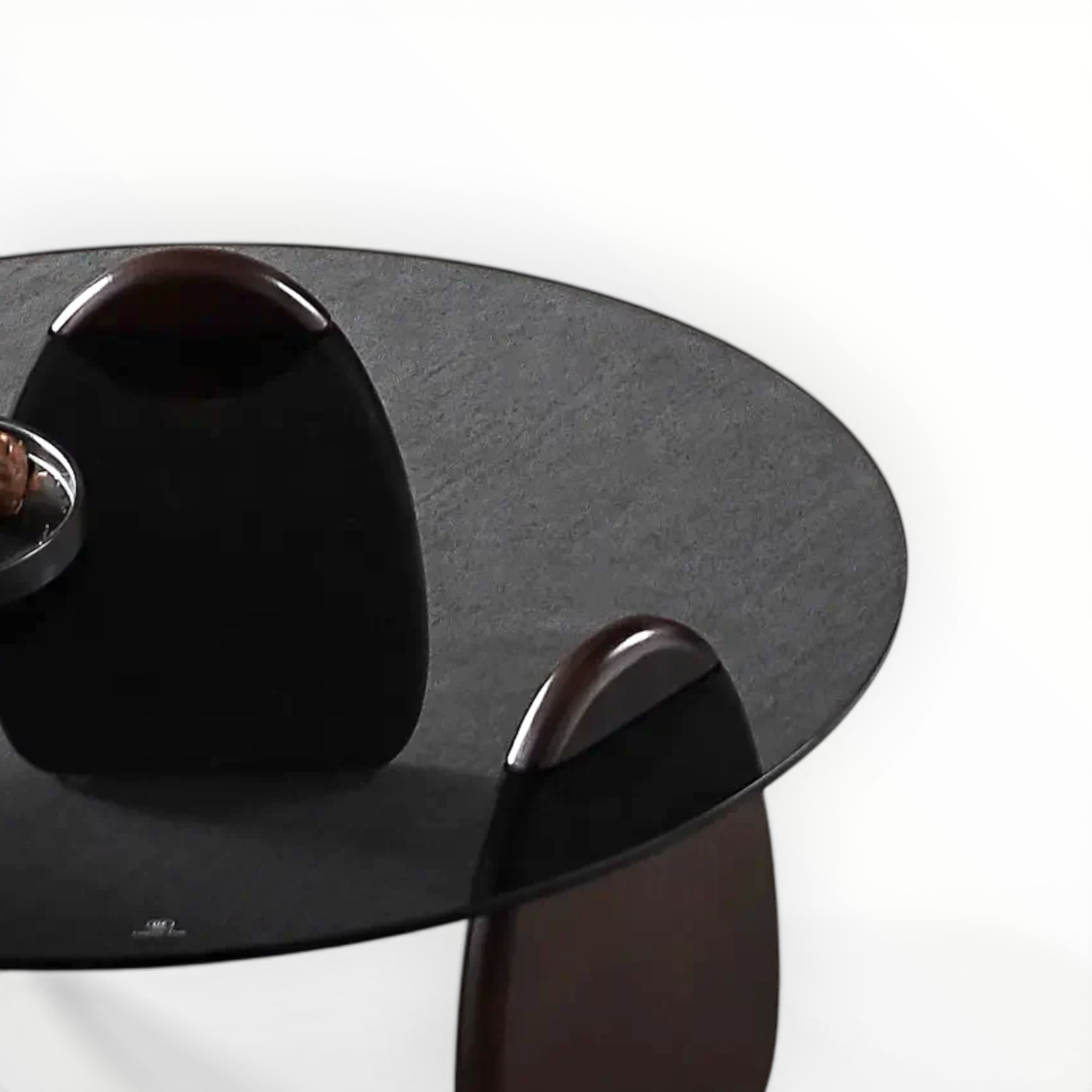 Modern black coffee table with metallic legs on a white background