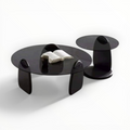 Modern black coffee table with a smaller matching side table on a white background
