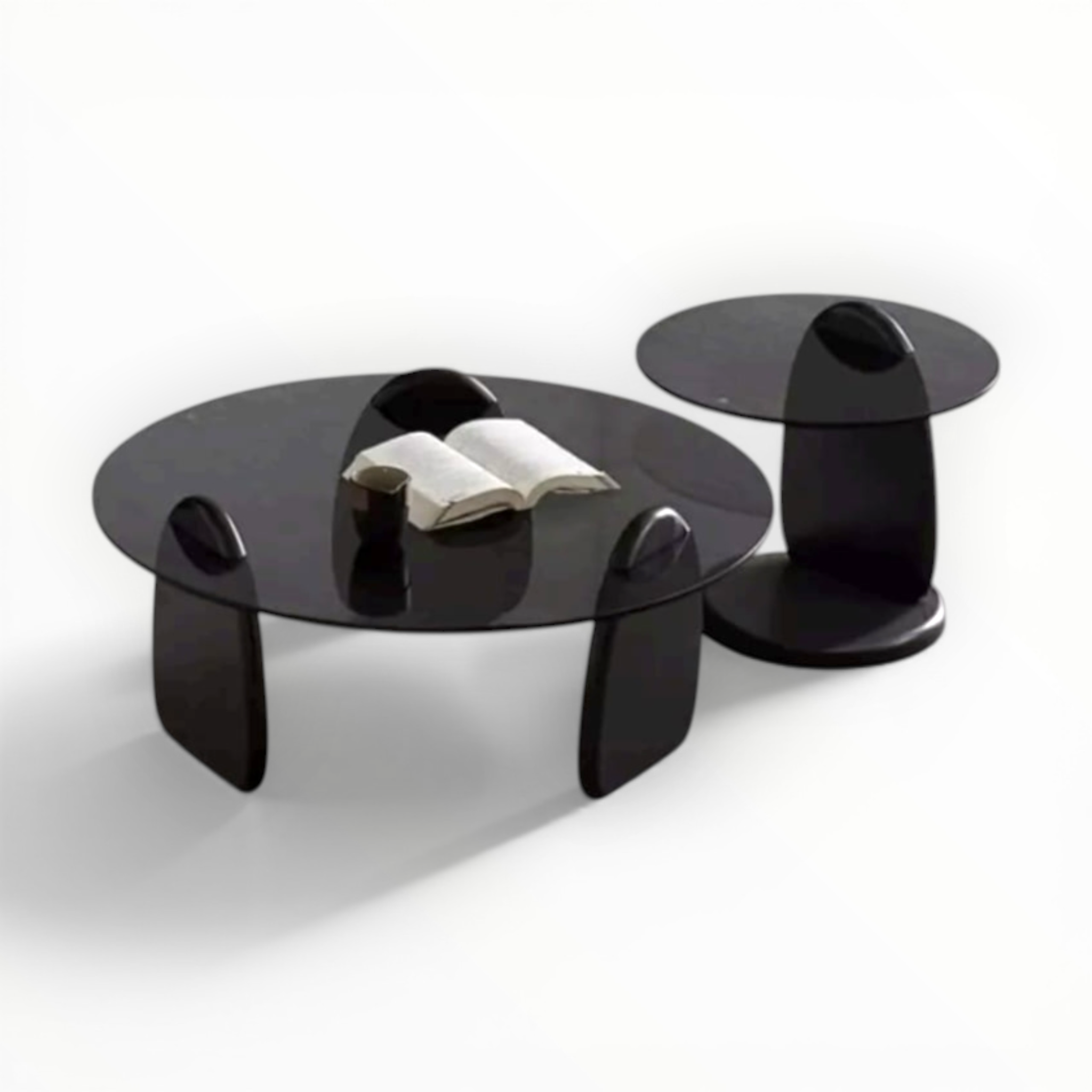 Modern black coffee table with a smaller matching side table on a white background