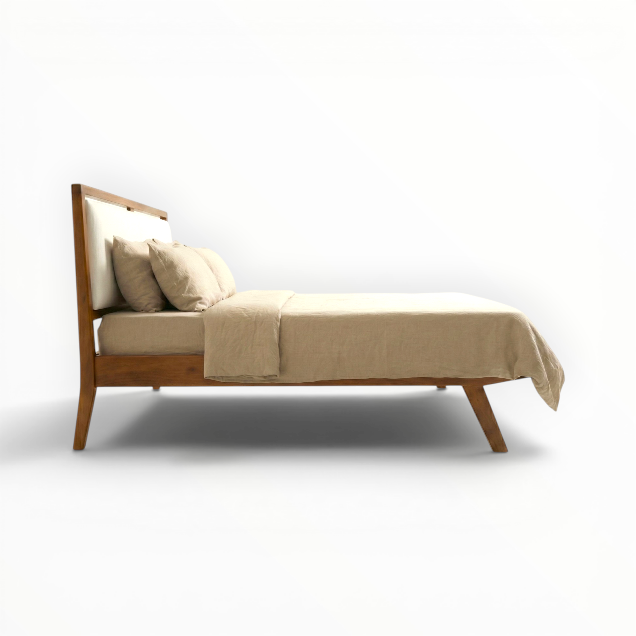 Wooden bed with beige bedding on a white background