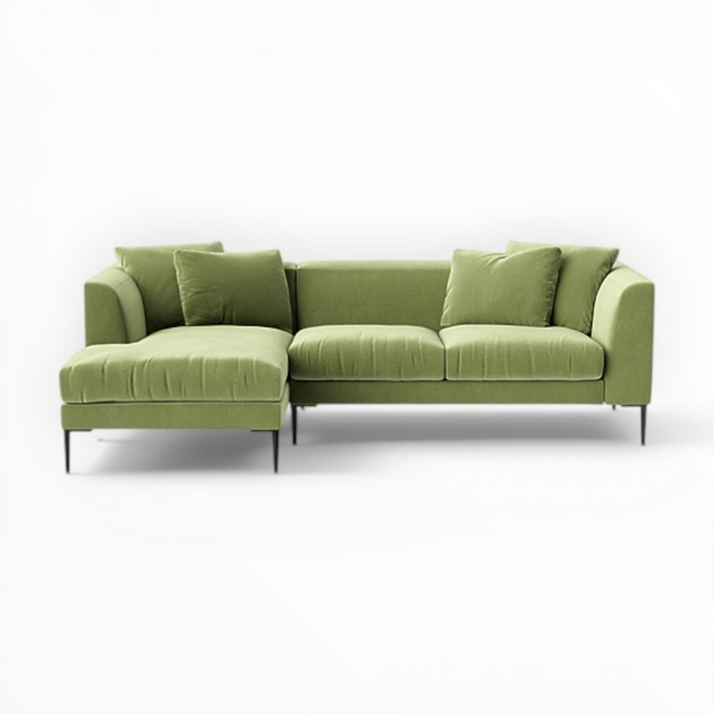 Green sectional sofa on a white background