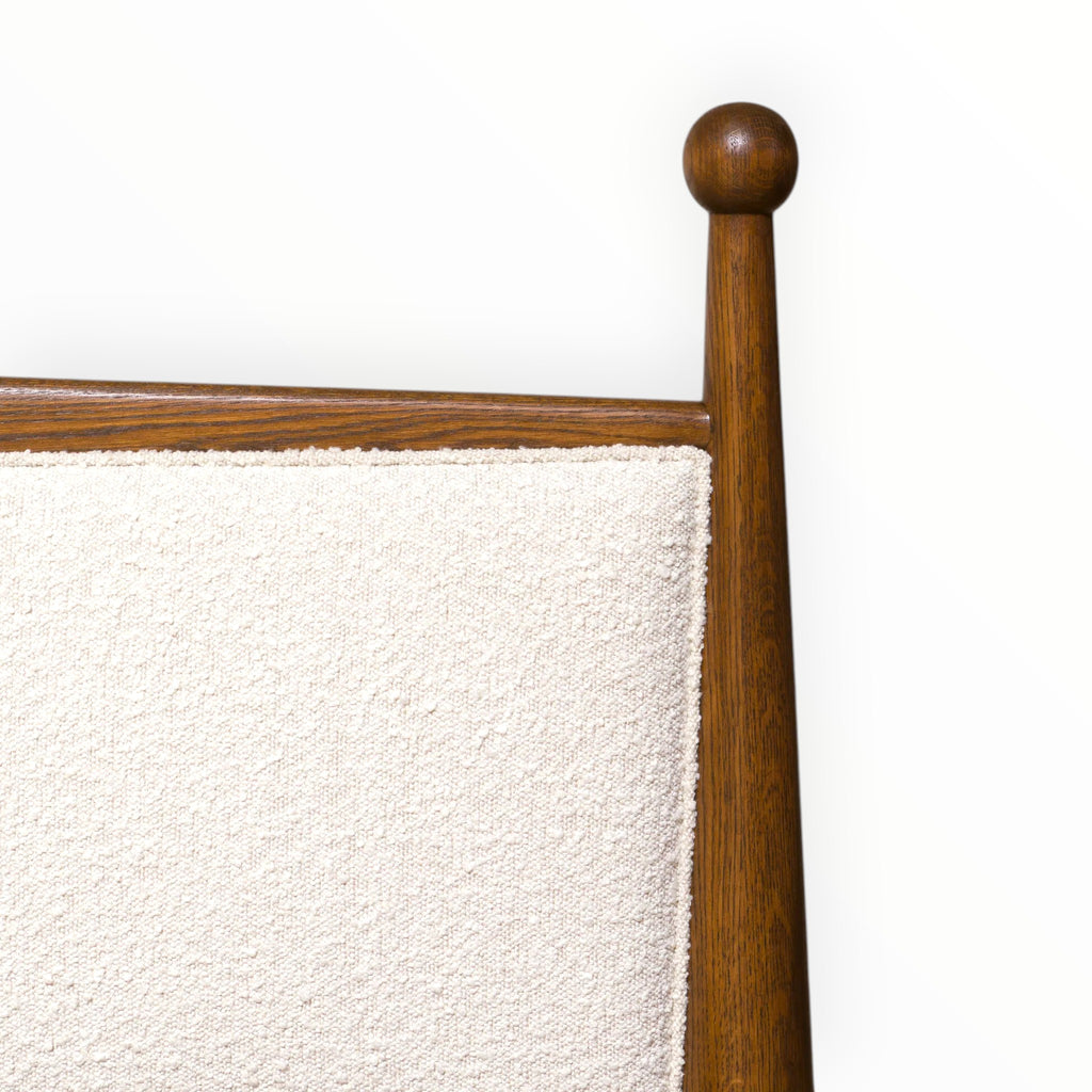 Wooden headboard with a textured white panel on a white background