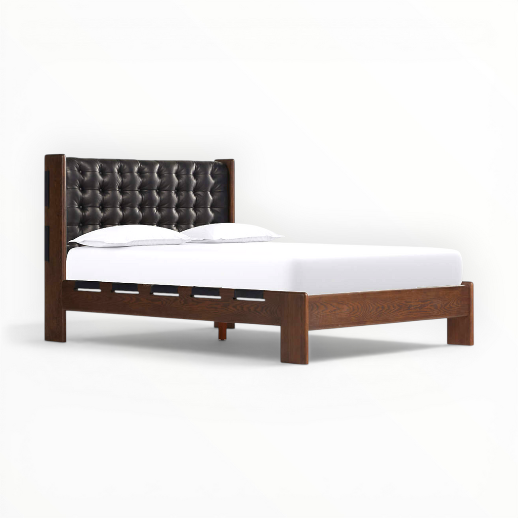 Wooden bed frame with tufted headboard on a white background