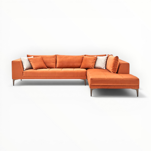Orange sectional sofa with cushions on a white background