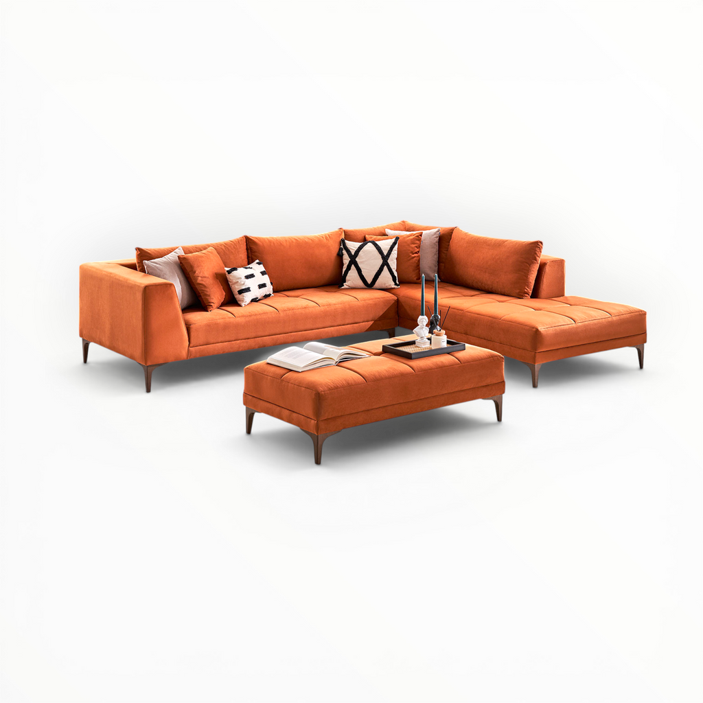 Orange sectional sofa with ottoman on a white background