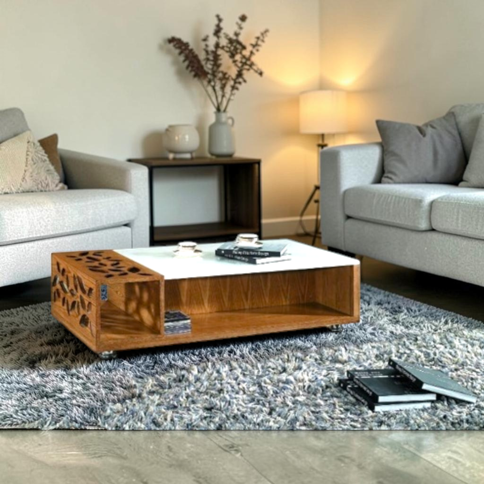 Modern living room with gray sofas, a wooden coffee table, and decorative elements.