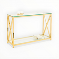 Gold console table with glass top and shelf on a white background