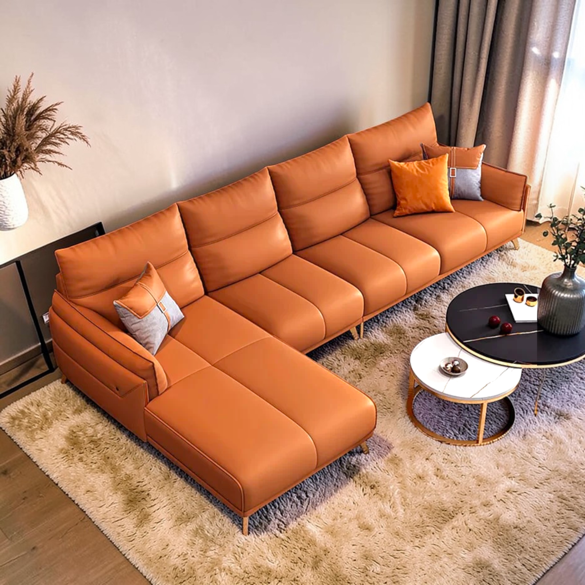 Orange sectional sofa in a living room setting with decor elements.