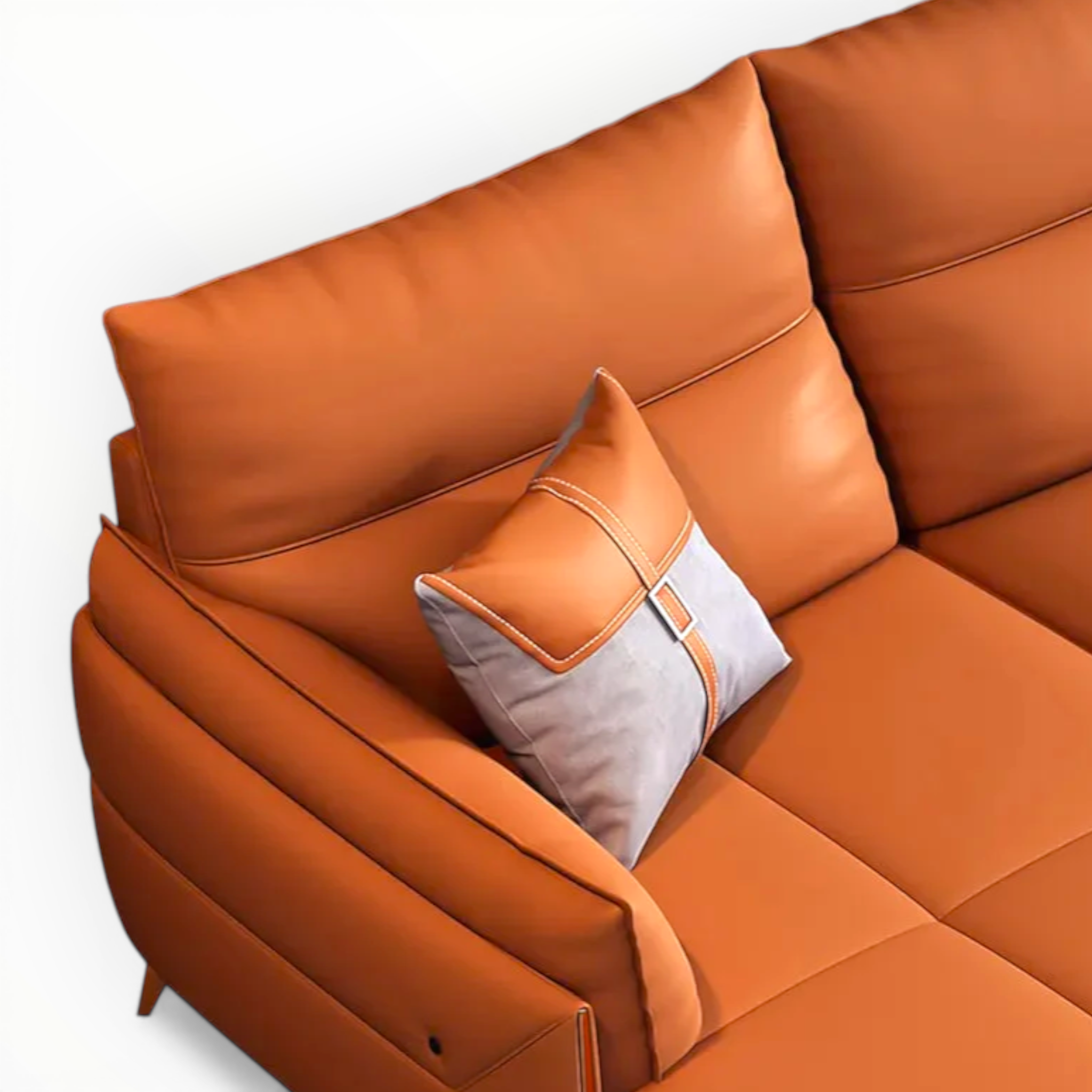 Orange sectional sofa with a pillow on a white background