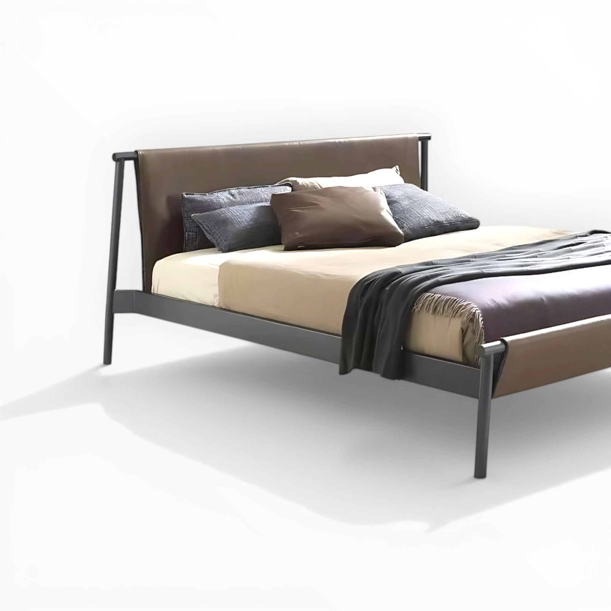 Bed with beige mattress, dark gray headboard, and pillows on a white background