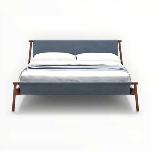 Bed with wooden frame and blue upholstered headboard on a white background