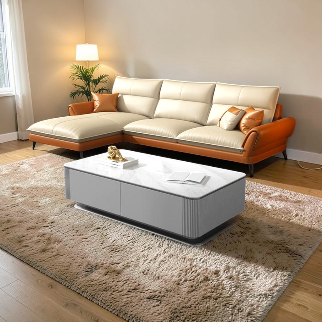 Modern living room with a sectional sofa, coffee table, and decorative items.