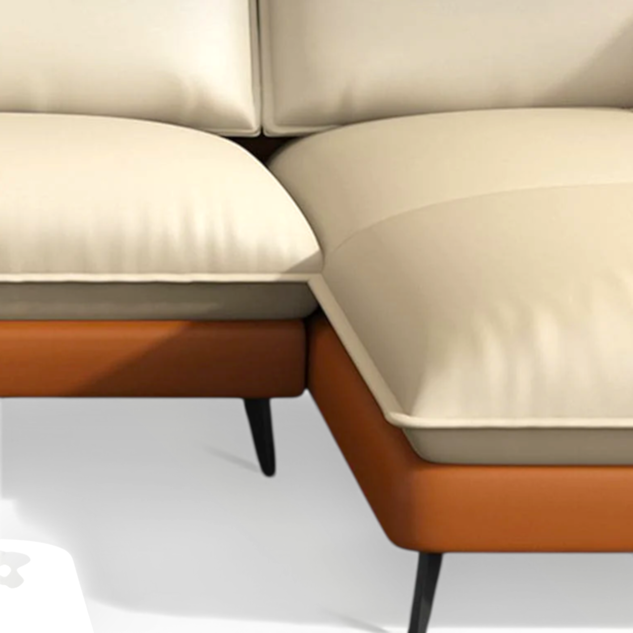 Close-up of a beige and orange sofa with a white background