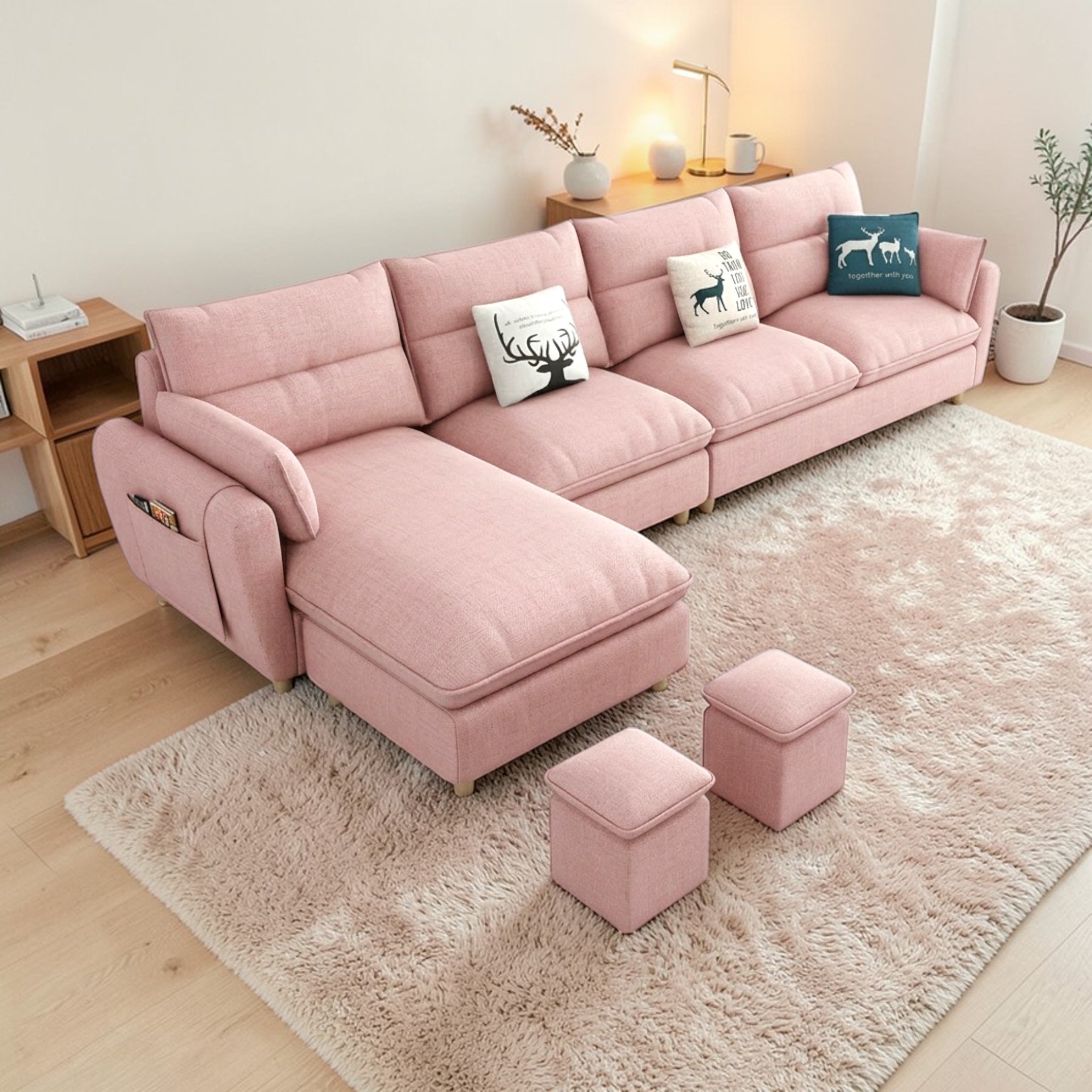 Pink sectional sofa with matching ottomans in a living room setting.