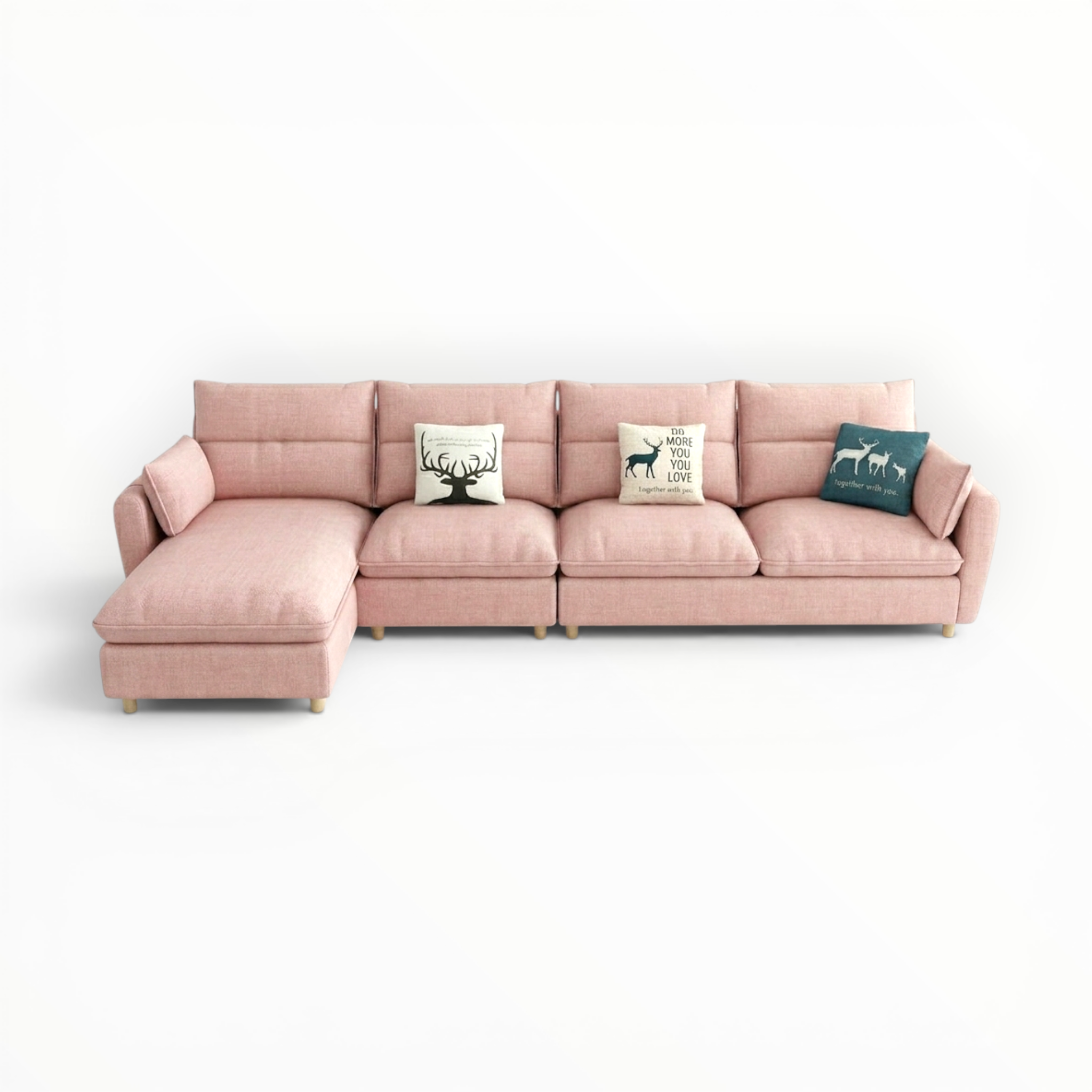 Pink sectional sofa with decorative cushions on a white background