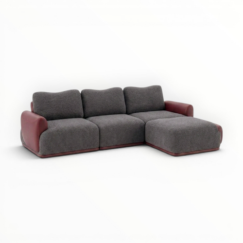 Gray sectional sofa with red accents on a white background