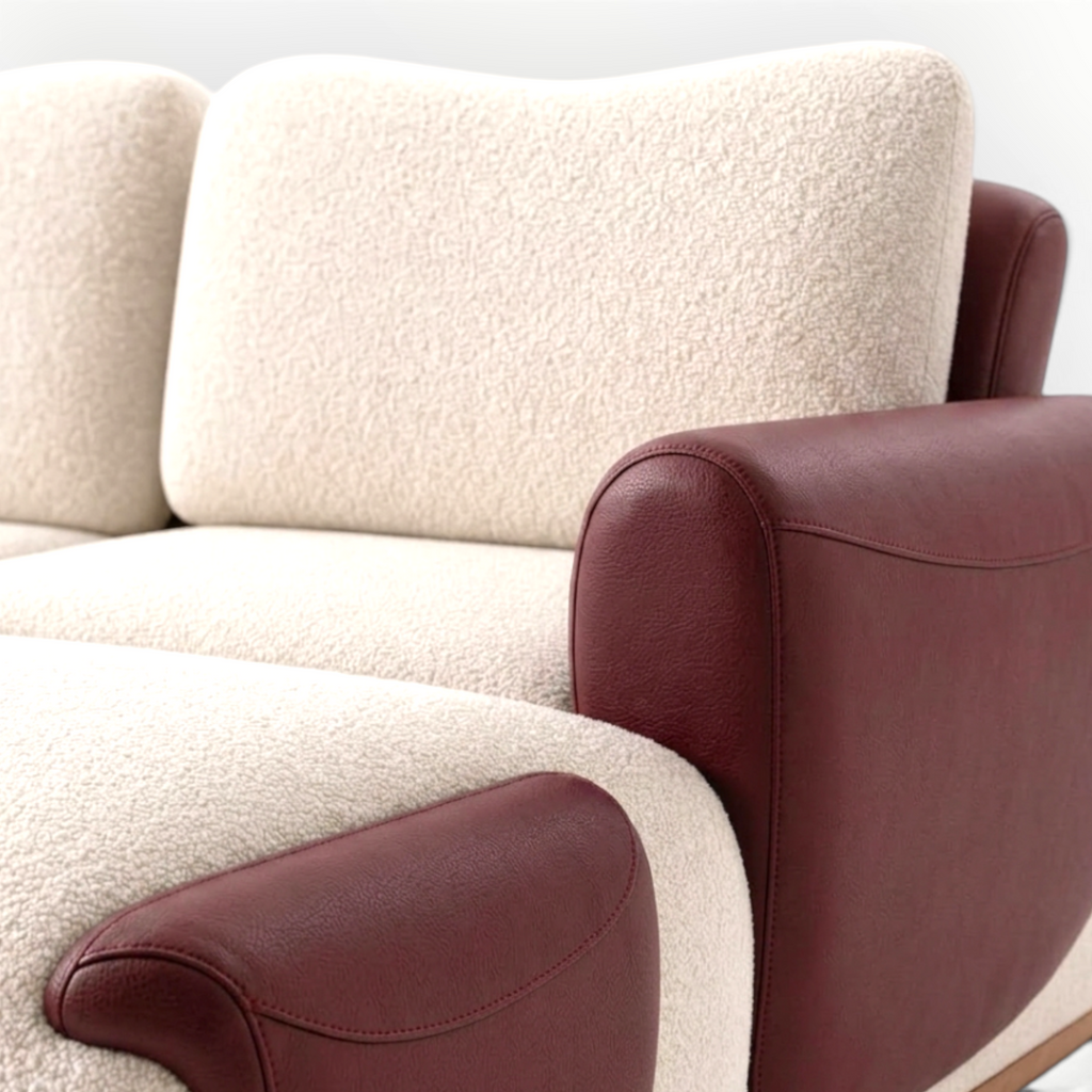 Beige sofa with brown leather armrests on a white background