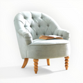 Light gray armchair with wooden legs on a white background