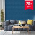 Modern living room with a gray sofa, wooden coffee table, and decorative items against a blue wall with a 20% off sign.