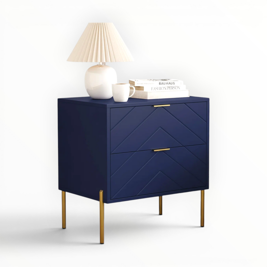 Blue nightstand with gold legs and decorative items on a white background