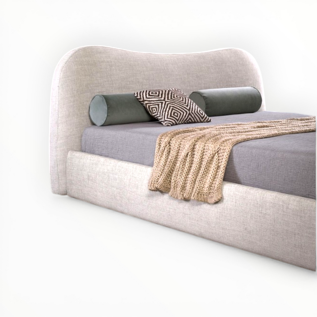 Modern bed with beige headboard and gray bedding on a white background