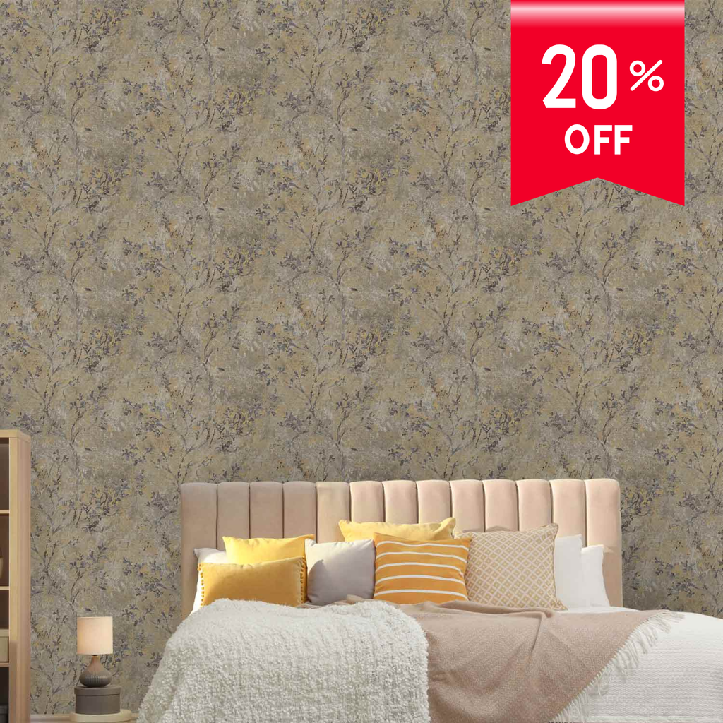 A styled bedroom scene showing a bed with neutral bedding and decorative pillows in front of a wall covered in a beige and gray floral-patterned wallpaper. A red promotional badge in the top right reads '20% OFF'.
