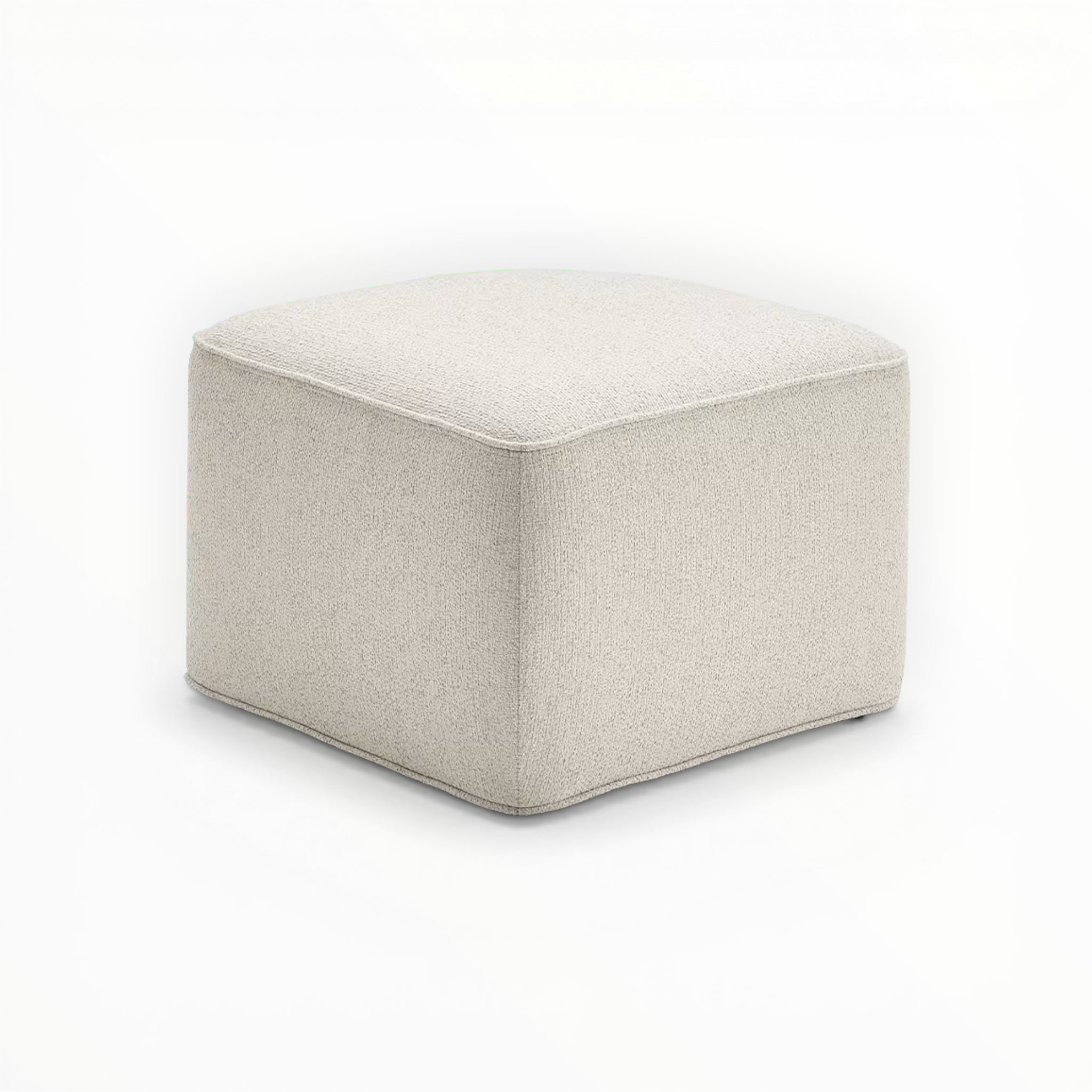 Beige cube-shaped ottoman on a white background