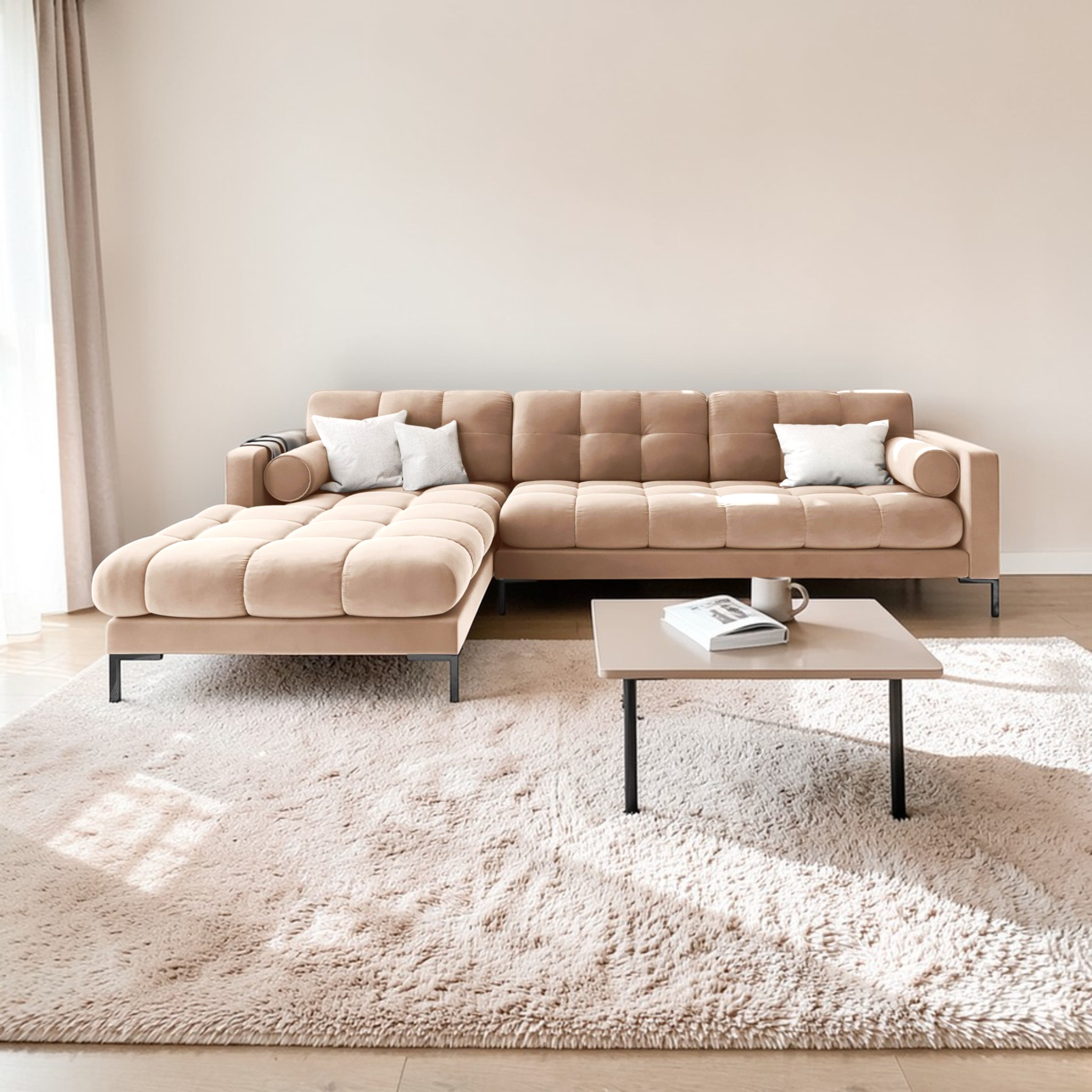 Beige sectional sofa in a modern living room with a coffee table and decor items.