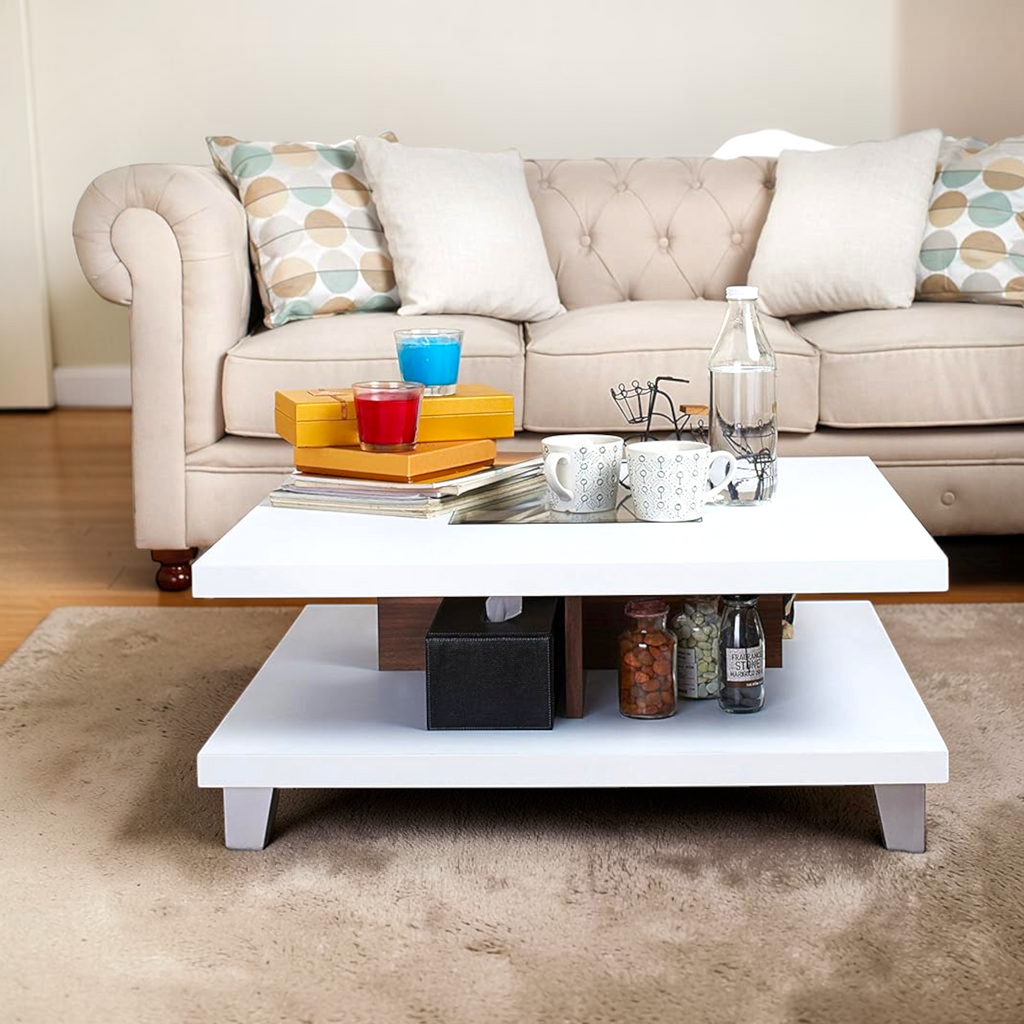 Beige sofa with decorative pillows and a white coffee table in a living room setting.
