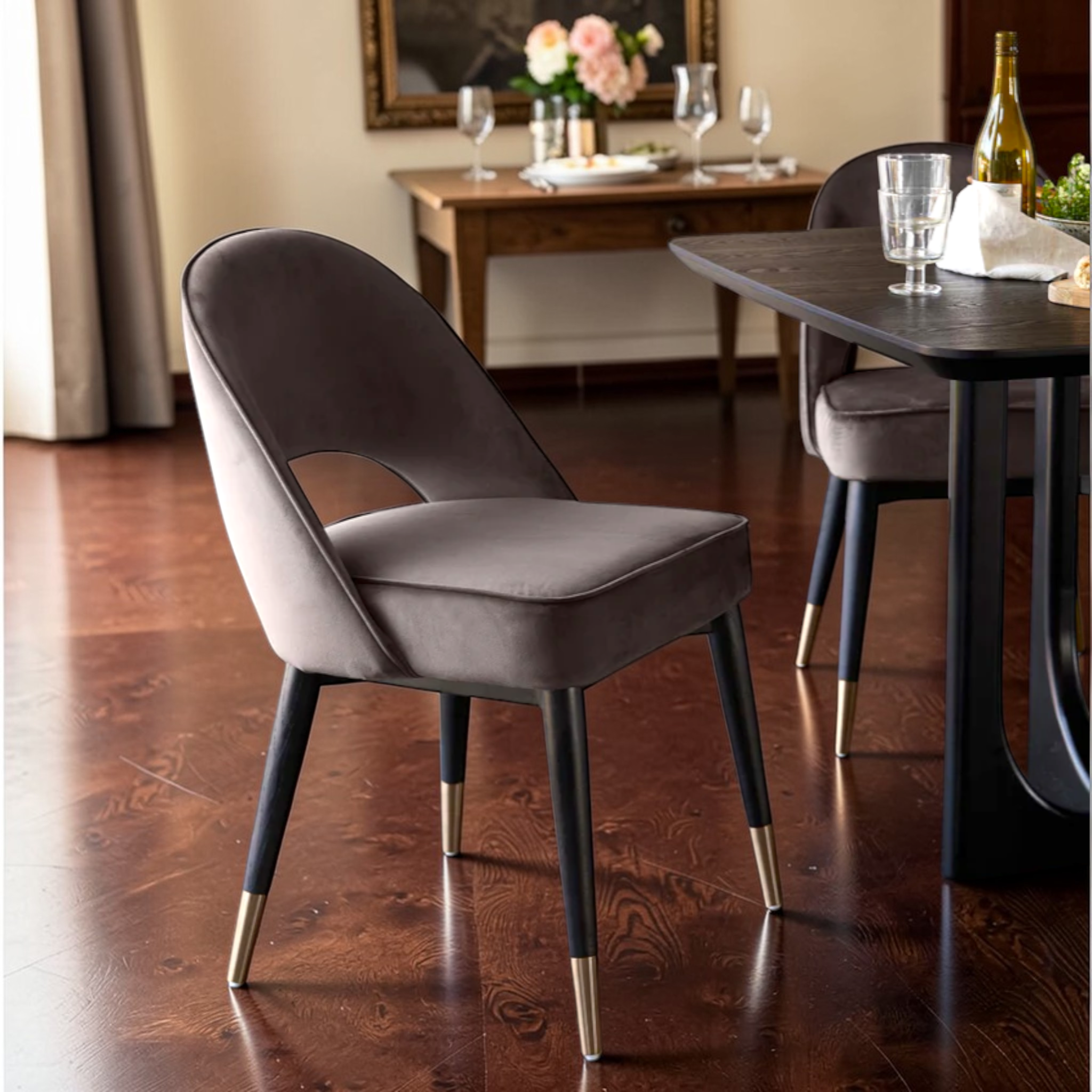 Gray chair with gold feet in a dining room setting