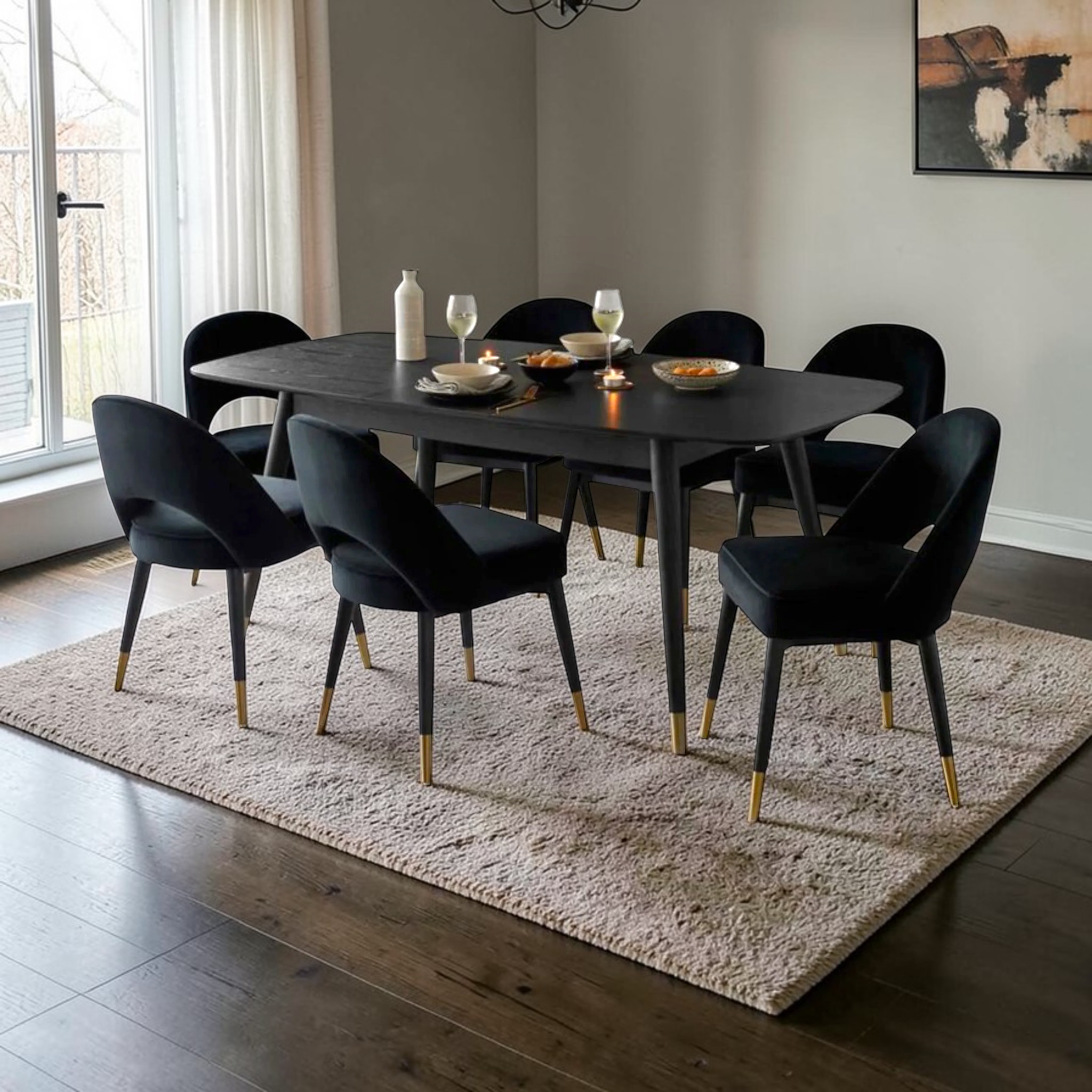 Dining room with a black table and chairs on a beige rug.